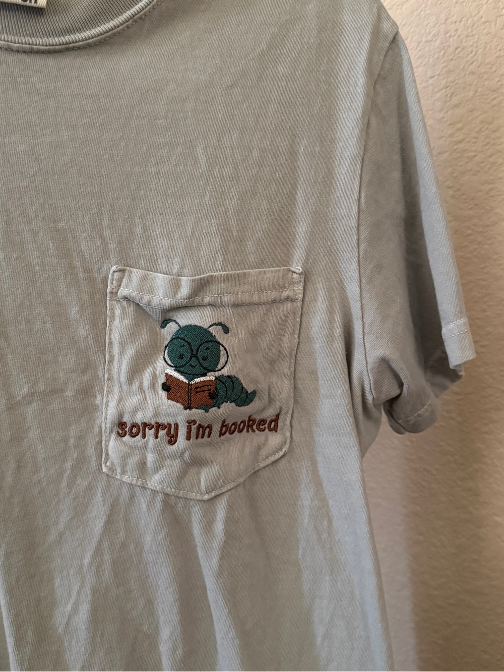 Comfort Colors Light Sage Pocket Tee with Embroidered Reading Caterpillar